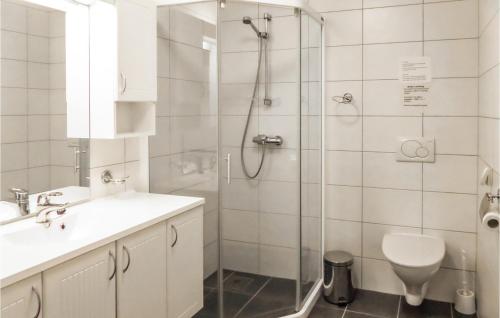 a bathroom with a shower and a sink and a toilet at Stunning Apartment In Valevg With 2 Bedrooms And Wifi in Valevåg