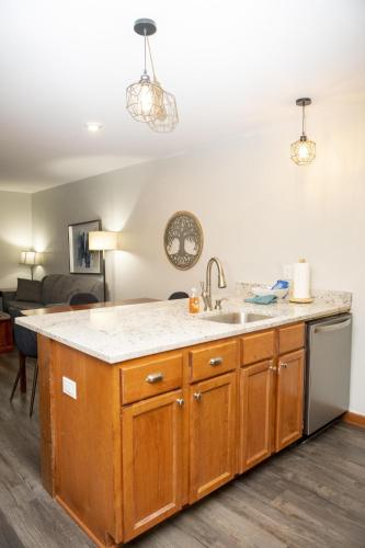 a kitchen with a sink and a counter at Allegheny Spring 239 KING, bed/Ski-In, Out/Pool & Hot Tub in Snowshoe