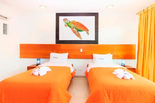 Cama o camas de una habitación en TortugaBayEC