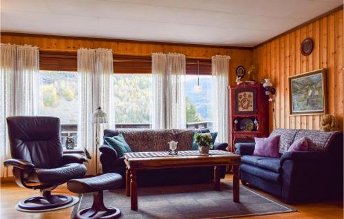 a living room with a couch and chairs and a table at Gorgeous Home In Bygland in Bygland