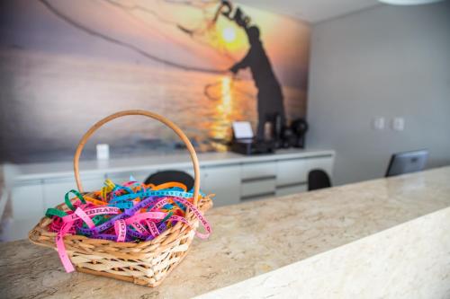 a basket of candy on a counter in a kitchen at Plattinum Hotel in Salvador