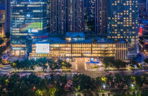 a view of a building in a city at night at Star Residence ICC Guangzhou in Guangzhou
