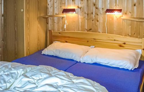 Un pat sau paturi într-o cameră la Glomnes Hjelle Nr,3