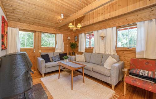 a living room with a couch and a table at 3 Bedroom Amazing Home In Sandane in Sandane