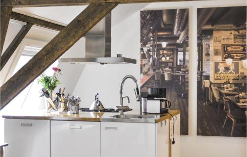a kitchen with white cabinets and a sink at 3 Bedroom Pet Friendly Home In Leende in Leende