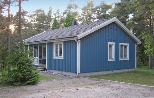a small blue house with white windows at 3 Bedroom Stunning Home In Slite in Slite