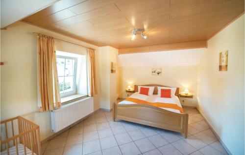 a bedroom with a bed and a window at Haus Engel-uriel in Steffeshausen