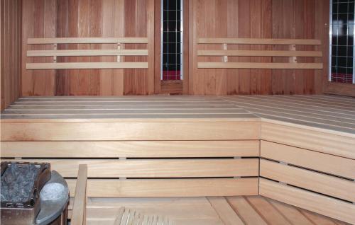an empty room with wooden walls and wooden floors at De Koestal in Wijdenes