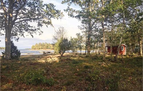 a view of a beach with trees and a shack at 4 Bedroom Cozy Home In Rockneby in Rockneby