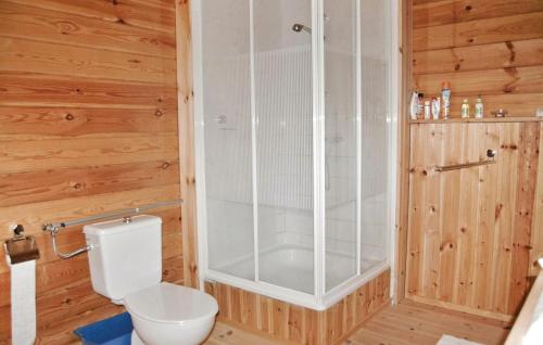 a bathroom with a toilet and a shower at Beautiful Home In Munkedal With Wifi in Munkedal