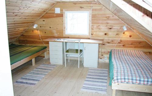 a room with a desk and a bed in a cabin at Beautiful Home In smo With 2 Bedrooms in Ösmo