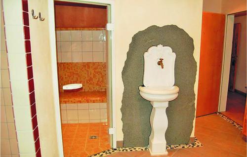 a bathroom with a toilet in the corner of a room at Beautiful Apartment In Kirchberg With Wifi in Kirchberg in Tirol