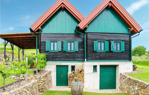a house with green doors and a green roof at Ferienhaus Kohfidisch in Kohfidisch