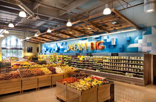 a store filled with lots of fruits and vegetables at Sky-Rise Apartments in Los Angeles