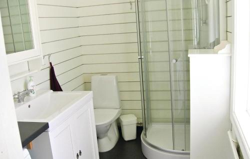 a bathroom with a shower and a toilet and a sink at 2 Bedroom Gorgeous Home In Bodafors in Bodafors