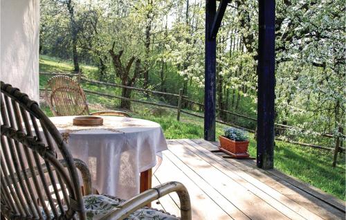a table and chairs on a porch with a view at Ferienhaus Gerersdorf-Güssing in Gerersdorf bei Güssing