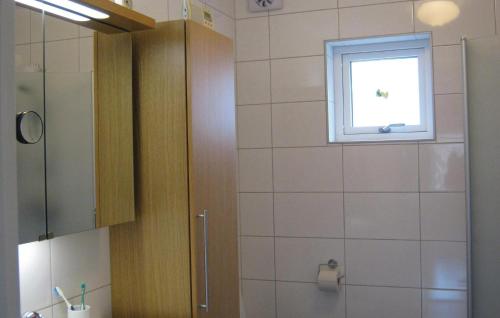 a bathroom with a shower and a window at Beautiful Apartment In Visby With 1 Bedrooms And Wifi in Visby