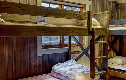 a couple of bunk beds in a cabin at Cozy Home In Vemdalen With Sauna in Vemdalen