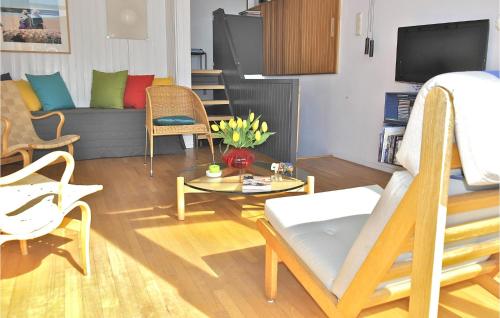 a living room with a couch and a table at De Trapjes in Bergen aan Zee