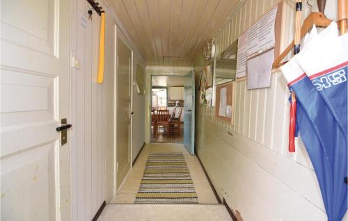 an empty hallway of a school building with a flag at Holiday Home Åsebo Mårdaklev in Sävekulla