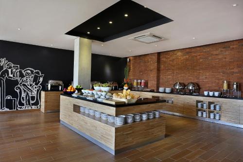 a kitchen with a counter in a room at Azana Boutique Hotel Denpasar in Denpasar