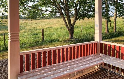 a porch with a view of a field and a tree at Cozy Home In Mantorp With Wifi in Mantorp