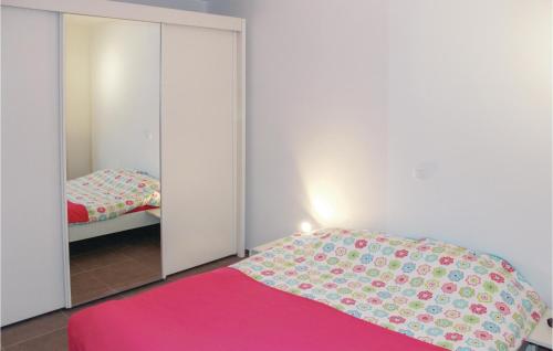 a bedroom with a bed with a pink blanket at Residence Helena in Ostend