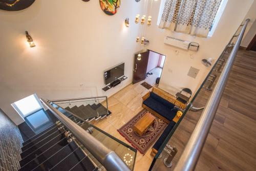 an overhead view of a staircase in a building at mezzanine villa W/T Hot Tub Jacuzzi in Kālapettai