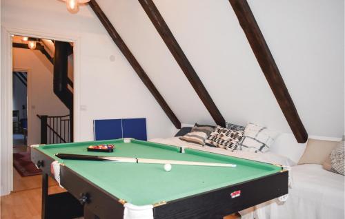 a room with a pool table and a couch at Lovely Home In Klippan With Sauna in Klippan