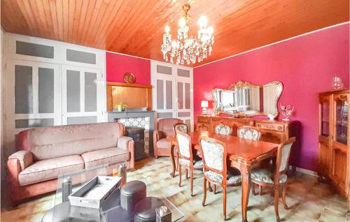 a living room with a couch and a table at Nice Home In Senlecques With Kitchen in Senlecques