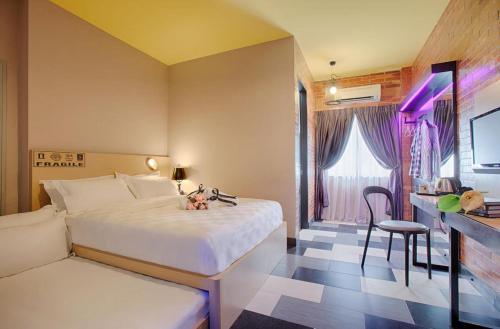 Postel nebo postele na pokoji v ubytování the youniQ Hotel, KLIA T1, KLIA T2