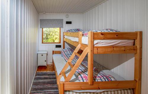 a bedroom with two bunk beds in a house at Holiday Home Farstad Rævhaugen in Farstad