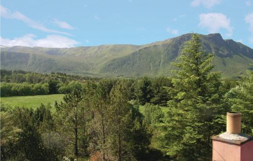 a view of the mountains from a house at Holiday Home Farstad Rævhaugen in Farstad