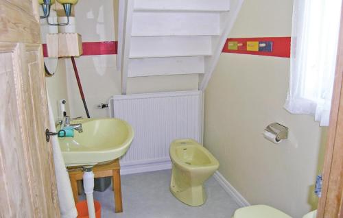 a bathroom with a sink and a toilet and stairs at Cozy Home In Visseltofta With Kitchen in Visseltofta
