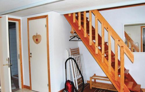a staircase in a house with a vacuum at Gorgeous Home In Ruda With Kitchen in Ruda