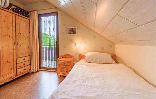 a small bedroom with a bed and a window at Ferienhaus 8 In Kirchheim in Kirchheim