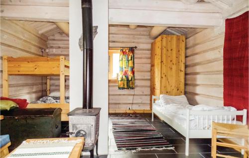 a room with a bed and a wood stove at Savalen Hestesenter in Trøan