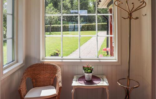 a room with a table and chairs and a window at Nice Home In Tranås With Kitchen in Tranås