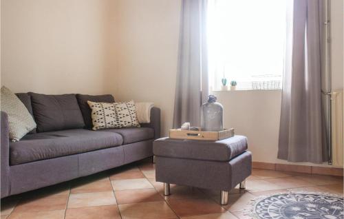 a living room with a couch and a table at Vakantiewoning 11 in Simpelveld