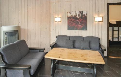 a waiting room with a couch and a table at Gorgeous Apartment In Hemsedal in Hemsedal