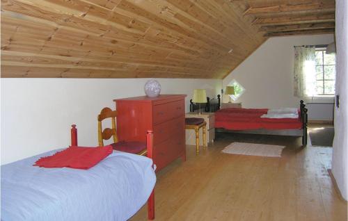 A bed or beds in a room at Nice Home In Annerstad With Kitchen