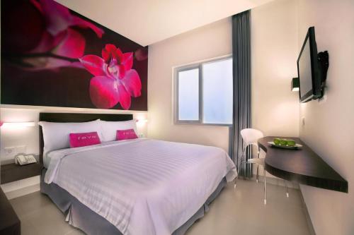 Cama o camas de una habitación en favehotel Melawai