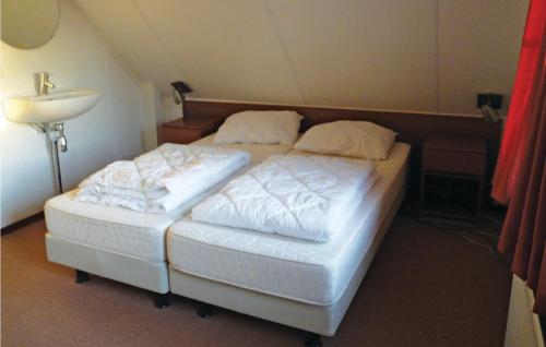 เตียงในห้องที่ Buitengoed Het Lageveld - 58