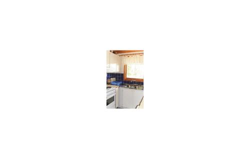 a view of a kitchen from the inside of a room at 1 Bedroom Awesome Home In Lagan in Lagan