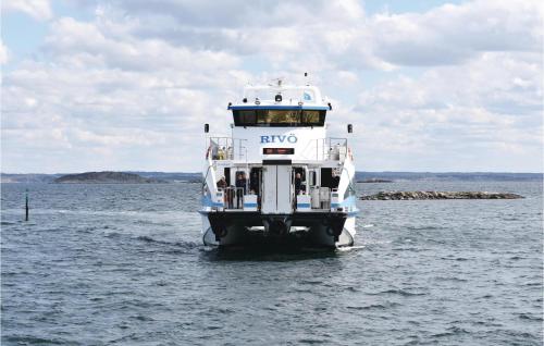a ferry boat in a body of water at 1 Bedroom Stunning Home In Vrångö in Vrångö