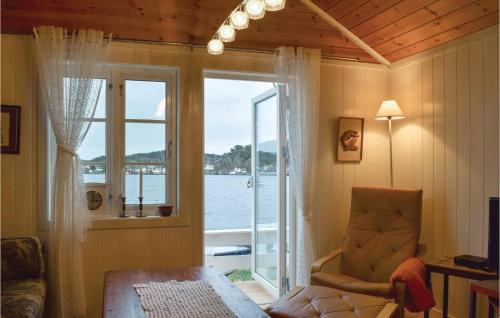 a room with a window with a view of the water at Nice Home In Staubø With House Sea View in Staubø
