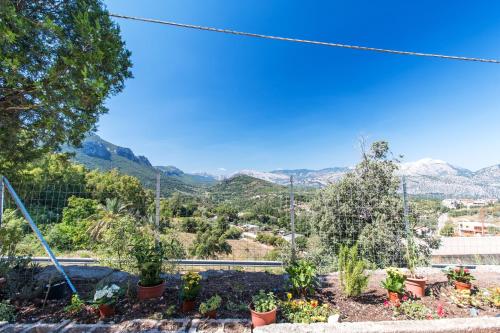 a view of the mountains from a garden at Gurosai in Dorgali
