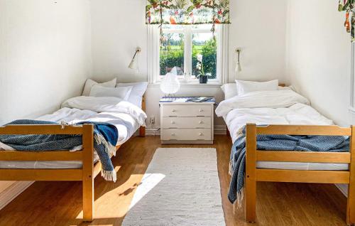 Cama ou camas em um quarto em 3 Bedroom Cozy Home In Borgholm