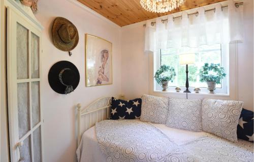 a room with a couch and a window at Cozy Home In Hjo With Wifi in Hjo
