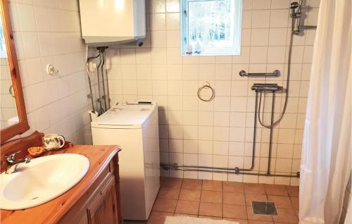 a bathroom with a sink and a shower at Amazing home in Unnaryd with 2 Bedrooms, Sauna and WiFi in Unnaryd